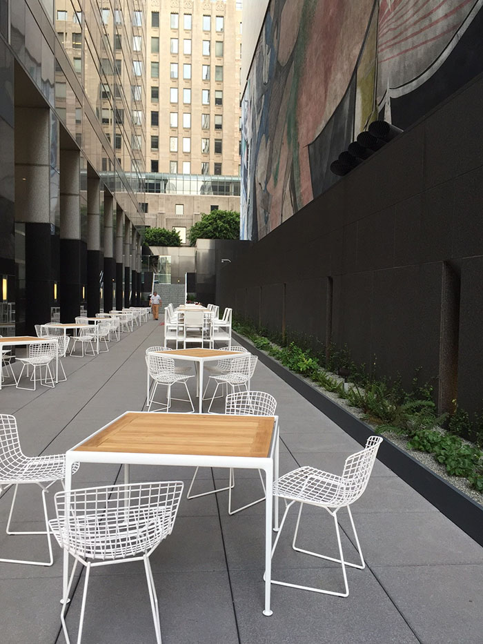 Bertoia Chairs and Schultz outdoor tables complete the patio at the new Los Angeles showroom